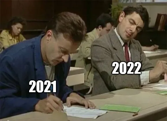 a meme showing an episode of Mr. Bean where he is copying another student's answers during an exam